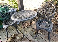 Full view of bistro table with two chairs on deck