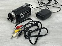 Camcorder with charger and AV cable laid out