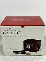 Front of retail box showing Decora wooden photo box with albums