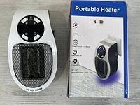 Heater unit beside retail box front view