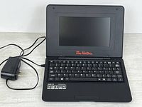 Open netbook with AC adapter shown