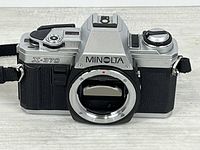 Front view showing Minolta X-370 body mount and strap