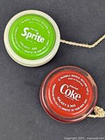 Sprite Galaxy 200 and Coke Galaxy S 300 yo-yos side by side