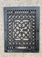 Full view of black cast iron heating grate front