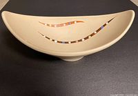 Top view of freeform shell bowl showing painted dot bands