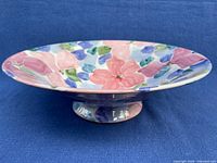 Side view of hand-painted floral footed compote showing shape and pedestal base