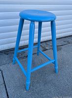 full view of stool upright showing paint and structure
