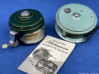 Shakespeare Tru-Art Automatic reel, Condex reel, and care booklet on blue background