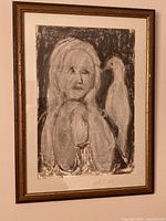 Framed monochrome pastel portrait of woman with dove, full view