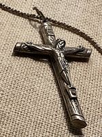 Close-up of crucifix pendant showing design details