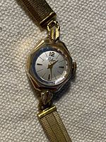 Close view of watch face, bezel, and partial bracelet