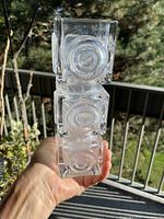 Full view of vase showing three stacked cubes and bullseye design