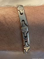 Bracelet worn on wrist showing link design and width