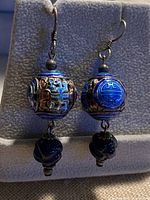 Front view of both earrings showing cloisonné beads and carved lapis drops