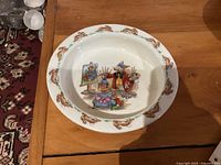 Top view of plate showing full Portrait Painter scene and rabbit border