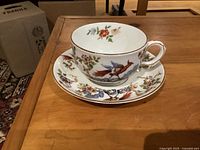 Cup on saucer displaying exterior decoration