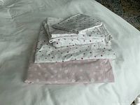 Stacked bedding pieces showing polka dot patterns