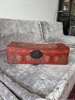 Front view showing painted motif and hasp clasp