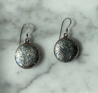 Front view of both engraved sterling silver locket earrings with ear wires