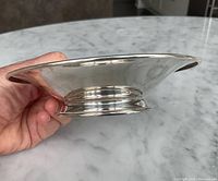 Side profile of bowl showing shallow form and foot