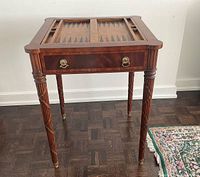 Full view of Maitland-Smith mahogany games table with in-place backgammon board