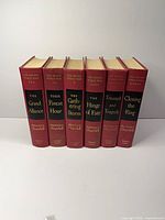 Front view of all six volumes standing upright