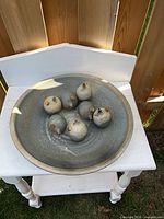 Bowl with six oil pots inside