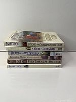 Stack of six Janette Oke books showing titles on spines