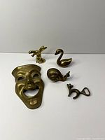 Group shot showing all five brass items