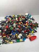 pile of assorted Lego and Mega Bloks bricks and accessories
