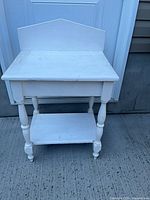 front view of white wooden side table