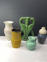 group shot of six assorted ceramic pieces