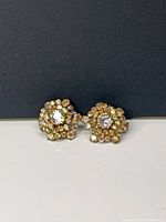 Front view of both earrings showing design and stones