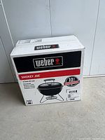 Full view of sealed Weber Smokey Joe grill box