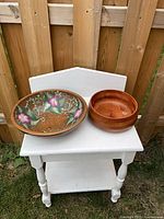 Both wooden bowls side by side showing relative size and finishes