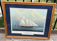 Full view of framed print showing image, mat, and frame