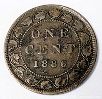 Reverse of 1886 Canada 1¢ coin with maple leaf wreath and date