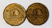 Both 1942 Canadian 5-cent coins full view