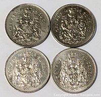 Group shot of all four Canadian 50-cent coins
