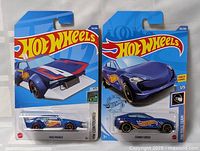 Front view of both packaged Hot Wheels cars