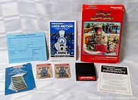 All contents laid out: box, cartridge, instruction booklet, overlays, warranty paperwork