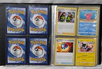 Binder open showing card backs and Digging Duo, Great Ball trainers