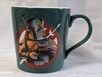 Front view of dark green mug showing Boba Fett graphic