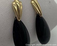 Front view of both earrings showing gold tops and black onyx drops