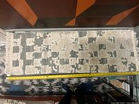 Full view of runner with tape measure for scale