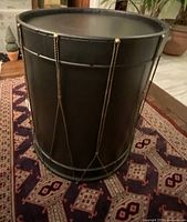 Full view of black metal drum side table