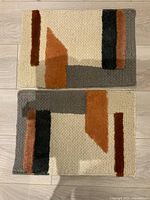 Pair of wool mats front view