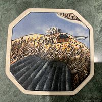 Front of octagonal plate with scenic illustration