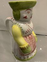 Right side view of figural jug