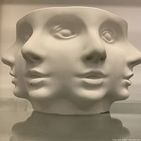 Front view showing face relief detail on bowl